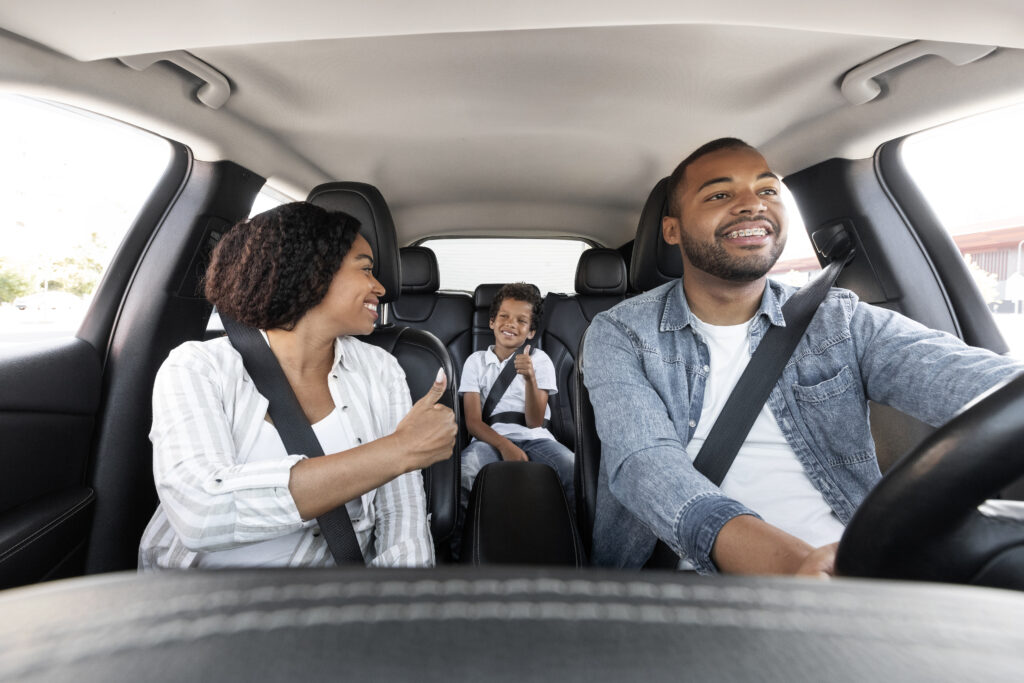 A family on a road trip listening to an audiobook together.